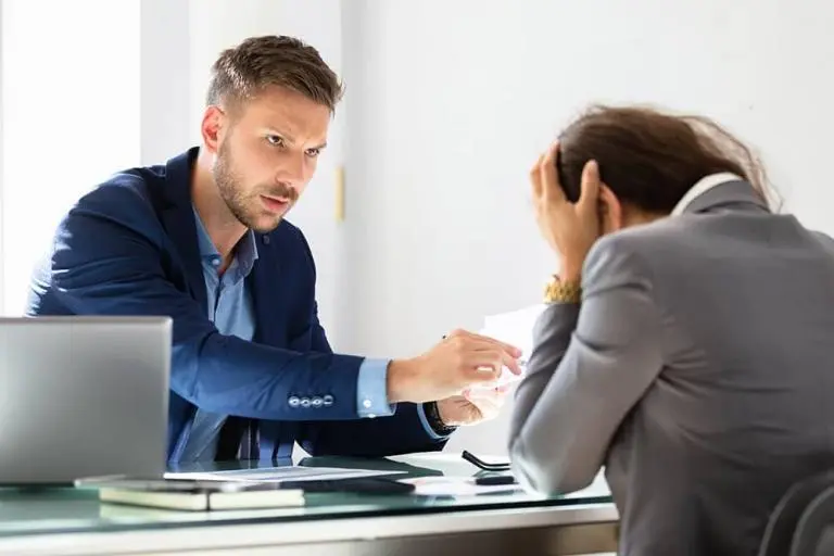Close-up of legal documents and a calculator on a desk symbolizing debt lawsuit defense services in Florida